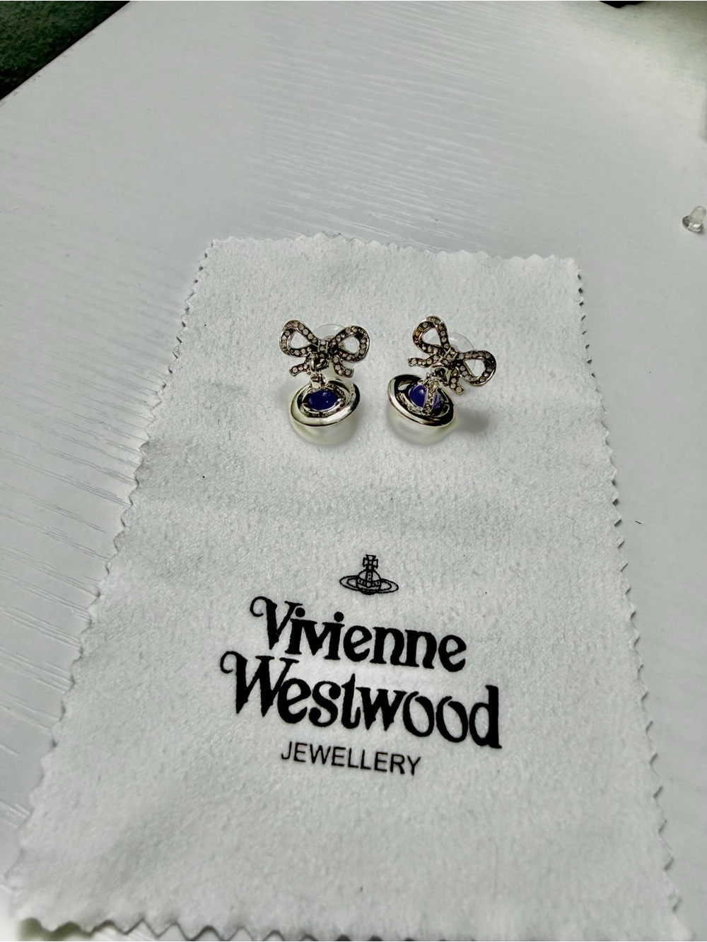 Vivienne Westwood Silver Bow Earrings with Blue Centers